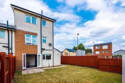 a house with a fence in front of it at Liverpool 4 Bed! Sleeps 9! Groups and Contractors! FREE OFF STREET PARKING! 3 Toilets! FREE WIFI! in West Derby