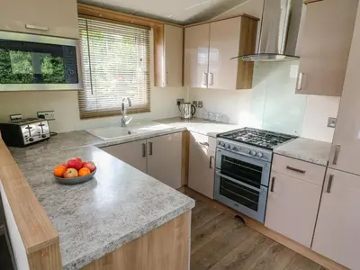 a kitchen with a bowl of fruit on the counter at Number 15 in Carnforth