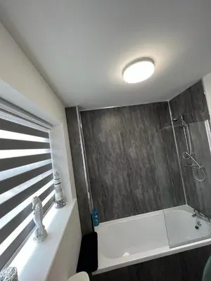 a bathroom with a shower and a sink at Blackpool Abode - Silver Sands in Blackpool