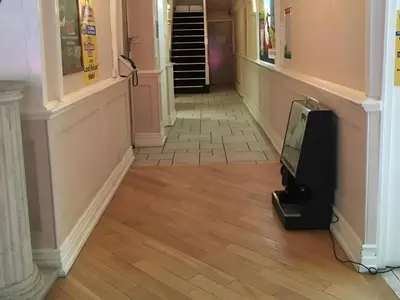 a tv sitting on the floor in a hallway at Lord Nelson Hotel-Lime Street Station Liverpool by Compass Hospitality in Liverpool