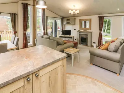 a living room filled with furniture and a fireplace at Coniston View 9 in Carnforth