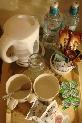 a table with a tea kettle and ingredients on it at Wendover Guest House in Bolton