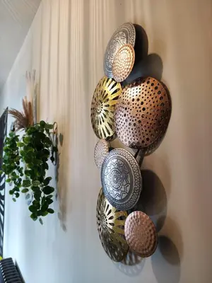 a bunch of decorative bowls on a wall at The Ribchester Arms in Blackburn