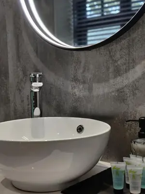 a white sink in a bathroom with a mirror at The Ribchester Arms in Blackburn