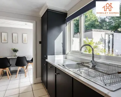 a kitchen with a sink and a window at Spacious 3 bedroom house with wifi and car parking By Hinkley Homes Short Lets & Serviced Accommodation in Waterloo