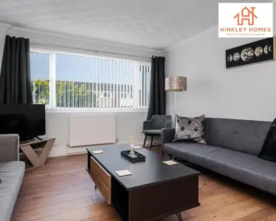 a living room with a couch and a coffee table at Spacious 3 bedroom house with wifi and car parking By Hinkley Homes Short Lets & Serviced Accommodation in Waterloo