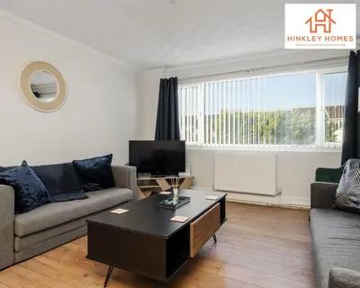 a living room with a couch and a coffee table at Spacious 3 bedroom house with wifi and car parking By Hinkley Homes Short Lets & Serviced Accommodation in Waterloo