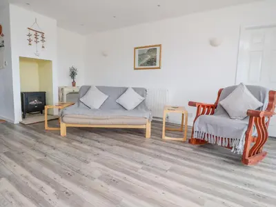 a living room with two chairs and a couch at Sea La Vie in Lytham St Annes