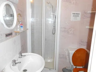 a bathroom with a toilet and a sink and a shower at The Lanes in Blackpool