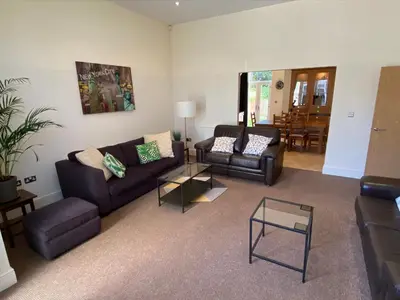 a living room with two couches and a table at The Shelbourne in Southport