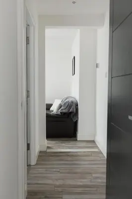 a hallway with a bed in the middle of a room at Windsor Stays 2 in Liverpool
