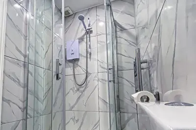 a bathroom with a shower and a sink at Velveteen by The V Group in Blackpool