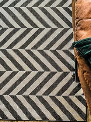 a black and white patterned rug on a floor at Velveteen by The V Group in Blackpool