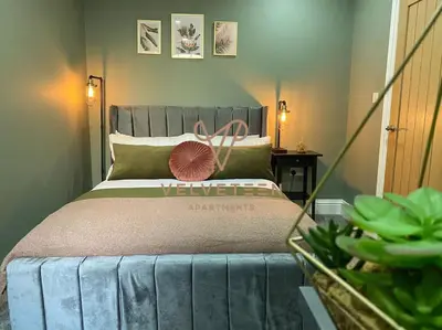 a bedroom with a bed with a welcome sign on it at Velveteen by The V Group in Blackpool