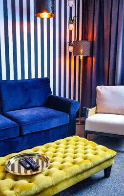 a living room with a couch and a coffee table at 24 Catharine Street Hotel in Liverpool