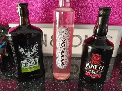 two bottles of alcohol sitting on top of a counter at The Dudley Hotel in Blackpool