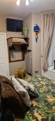 a bedroom with a bed with pillows on it at The Dudley Hotel in Blackpool