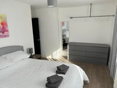 a bedroom with a bed with two towels on it at Windsor stays 1 in Liverpool