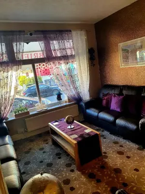 a living room with a couch and a coffee table at Gabrielles in Blackpool