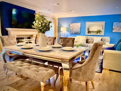 a dining room with a table and chairs at Beautiful Hot Tub Suite in Lytham St Annes in Lytham St Annes