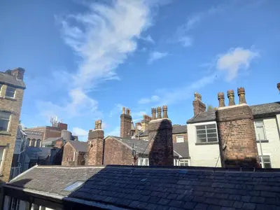 a group of brick chimneys on top of a roof at L2 Apartments- City Center- 2 bed in Liverpool