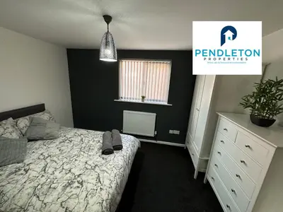 a bedroom with a bed and a white dresser at Cosy Central APT, 10 Min Walk to UCLAN and Library in Preston