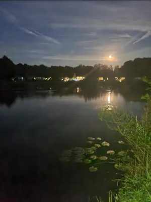 a view of a lake at night at Nicks and Carmels by the Lake in Carnforth