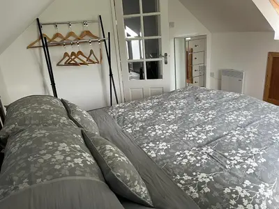 a bedroom with a large bed in a room at Green Little Acre in Little Singleton
