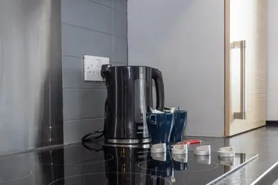a coffee maker sitting on a counter in a kitchen at GuestReady - Modern stay in Bispham House in Liverpool