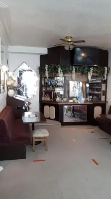 a living room with a couch and a table at Aysgarth House in Blackpool