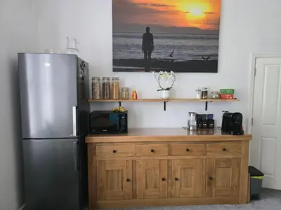 a kitchen with a refrigerator and a wooden counter at Victorian Renovation Room 7 in Liverpool