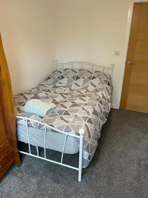 a small bed in a room with a bed frame at Lovely, Sleeps 8, Cafe Bars, Central Formby in Formby