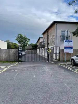 a gate in front of a house with a fence at Lovely, Sleeps 8, Cafe Bars, Central Formby in Formby