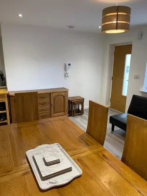 a kitchen with a wooden table with a plate on it at Lovely, Sleeps 8, Cafe Bars, Central Formby in Formby