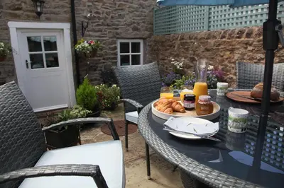 a table with a tray of food on a patio at Number 10 in Whalley