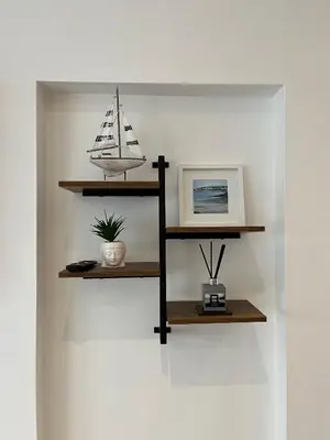 a shelf with a toy boat on a wall at 20 Coop Street Apartments in Blackpool