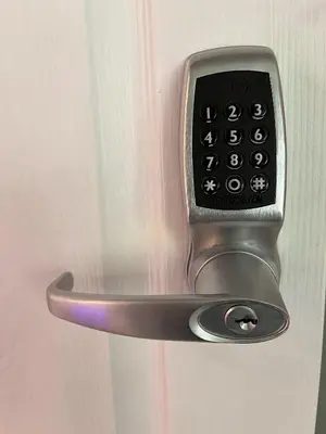 a close up of a door handle with a remote control at 20 Coop Street Apartments in Blackpool