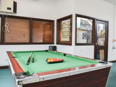 a pool table with a bowl of fruit on it at Methera Cottage - Uk41487 in Spark Bridge