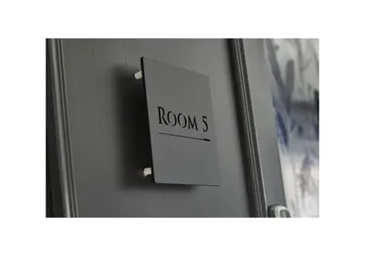 a door with a sign that reads room at Home at 2 Tancred Road Anfield in Liverpool