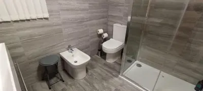 a small bathroom with a toilet and a sink at Home from Home near LFC & train station in Liverpool