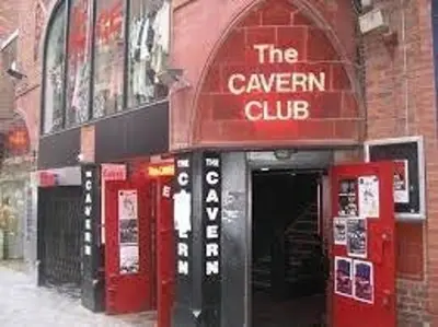 a red building with a cavern club sign on it at City Centre Vintage Theme Guest Rooms in Liverpool