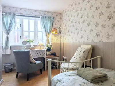 a bedroom with a bed and a chair and a desk at City Centre Vintage Theme Guest Rooms in Liverpool