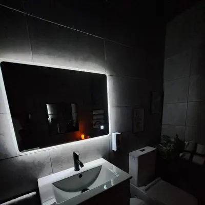 a bathroom with a sink and a mirror and a toilet at Family Holiday with Hot tub , Family groups only in Blackpool