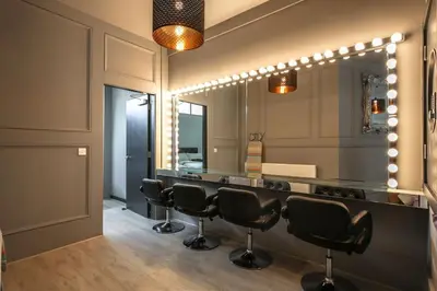 a salon with a bar with black chairs and a mirror at Manhattan Suite - sleeps 24! Heart of Liverpool in Liverpool