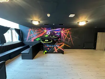 a room with a wall with a painting on it at Unique city centre DJ apartment - sleeps 20 in Liverpool