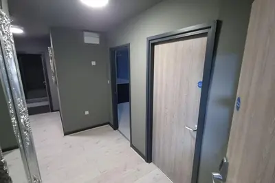 a room with two doors and a wooden floor at Unique city centre DJ apartment - sleeps 20 in Liverpool