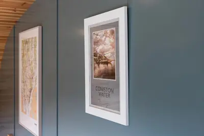 a framed picture hanging on a wall in a room at High Longlands in Cartmel