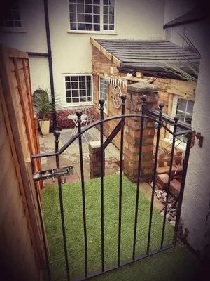an iron gate in front of a house at Sea-Quinn Views in Wallasey