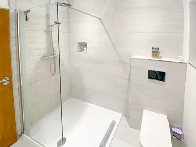 a bathroom with a shower and a toilet at Newcastle Lodges in Thornton