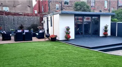 a garden office with a green lawn at Lovely unit elgin drive Coastal Bliss Your Seaside Retreat with City Excitement in Wallasey